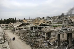 Một ngôi làng tại thị trấn Kobane, Syria bị phá hủy ngày 27/3 vừa qua. (Ảnh: AFP/TTXVN)