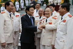 Chủ tịch nước Trương Tấn Sang với các thế hệ tướng lĩnh Công an qua các thời kỳ. (Ảnh: Nguyễn Khang/TTXVN)