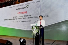 Tổng giám đốc Vietcombank Phạm Quang Dũng báo cáo kết quả hoạt động kinh doanh tại hội nghị. (Nguồn: Vietcombank)