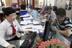 Giao dịch tại Agribank. (Nguồn: TTXVN)