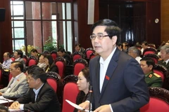 Bộ trưởng Bộ Nông nghiệp và Phát triển nông thôn Cao Đức Phát trả lời các câu hỏi của đại biểu Quốc hội. (Ảnh: Nhan Sáng/TTXVN)