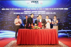 Ký kết hợp tác giữa các công ty của Việt Nam và Campuchia. (Ảnh: Quang Anh/TTXVN)