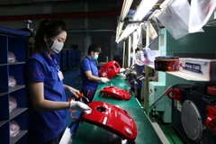 Các linh kiện nhựa tại nhà máy Công ty cổ phần công nghiệp hỗ trợ Minh Nguyên (Khu công nghệ cao Thành phố Hồ Chí Minh). (Ảnh: An Hiếu/TTXVN)