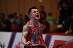 Cảm xúc của VĐV Nông Văn Hữu sau khi giành HCV môn Wushu nội dung Nam đao. Ảnh: Hoàng Linh - TTXVN