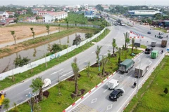 Tuyến đường trục Trung tâm khu đô thị mới Mê Linh, đoạn giáp ranh địa phận huyện Bình Xuyên (Vĩnh Phúc) và huyện Mê Linh (Hà Nội). (Ảnh minh họa: Hoàng Hùng/TTXVN)