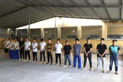 Các đối tượng bị tạm giữ. (Ảnh: TTXVN phát)