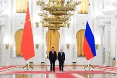 Chủ tịch Trung Quốc Tập Cận Bình (trái) và Tổng thống Nga Vladimir Putin tại Điện Kremlin ở Moskva tối 21/3/2023. Ảnh: AFP/TTXVN