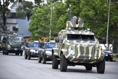 Các lực lượng nghiệp vụ diễu hành biểu dương lực lượng sau Lễ ra quân. (Ảnh: TTXVN phát)