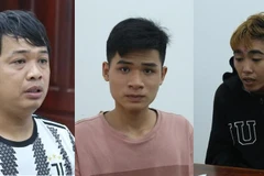 Các đối tượng tại cơ quan điều tra. (Ảnh: TTXVN phát)