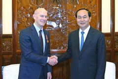Chủ tịch nước Trần Đại Quang tiếp ông Kevin Jenkins, Chủ tịch Tổ chức Tầm nhìn Thế giới (World Vision International) đang thăm và làm việc tại Việt Nam. (Ảnh: Nhan Sáng/TTXVN)
