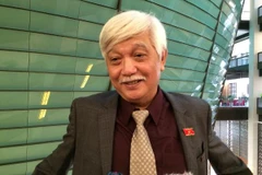 Đại biểu Hoàng Văn Cường, đoàn Hà Nội trả lời báo chí. (Ảnh: Thúy Hà/Vietnam+)