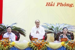 Chủ tịch nước Nguyễn Xuân Phúc chủ trì hội thảo. (Ảnh: Thống Nhất/TTXVN)