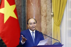 Chủ tịch nước Nguyễn Xuân Phúc phát biểu tại buổi gặp mặt. (Ảnh: Thống Nhất/ TTXVN)