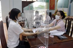 Ngân hàng Chính sách Xã hội tỉnh Bắc Giang giải ngân vốn vay ưu đãi theo Nghị quyết 11 của Chính phủ. (Ảnh: Đồng Thúy/TTXVN)