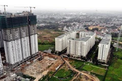 Bộ Tài chính đề nghị Ủy ban Nhân dân ban hành Bảng giá đất, bao gồm cả hệ số điều chỉnh giá đất nhằm tạo điều kiện cho công tác tính thuế theo quy định. (Ảnh: Danh Lam/TTXVN)