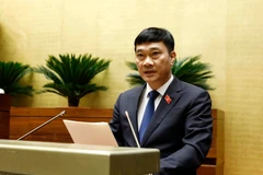 Chủ nhiệm Ủy ban Kinh tế của Quốc hội Vũ Hồng Thanh trình bày Báo cáo thẩm tra dự án Luật Phòng, chống rửa tiền (sửa đổi). (Ảnh: An Đăng/TTXVN)
