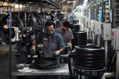 Việt Nam có nền kinh tế rất mở nhưng tăng trưởng GDP lại có diễn biến ngược so với thế giới. (Ảnh: TTXVN)