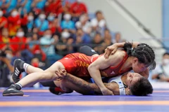 Vận động viên Nguyễn Thị Xuân (áo đỏ). (Ảnh: Trần Việt/TTXVN)