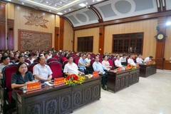 Các đại biểu dự hội nghị tại điểm cầu Hội trường UBND tỉnh Hà Nam. (Ảnh: Thanh Tuấn/TTXVN)