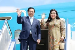 Thủ tướng Phạm Minh Chính và Phu nhân. (Ảnh: Dương Giang/TTXVN)