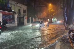 Nước ngập trên phố Đội Cấn, Hà Nội. (Ảnh minh họa: Mạnh Khánh/TTXVN)