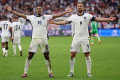 Jude Bellingham (trái) và Harry Kane sẽ tiếp tục tỏa sáng để giúp Anh chiến thắng? (Ảnh: AFP/TTXVN)