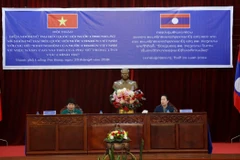 Bà Nguyễn Thúy Anh và bà Thummaly Vongphachanh chủ trì Hội thảo. (Ảnh: Phạm Kiên/TTXVN)