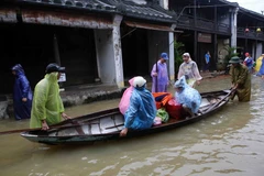 Nhiều nhà dân ở phố cổ Hội An, Quảng Nam bị chìm ngập trong nước lũ. (Ảnh: Trần Lê Lâm/TTXVN)