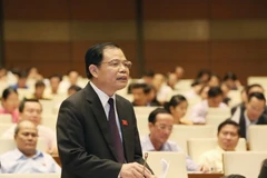 Bộ trưởng Bộ Nông nghiệp và Phát triển nông thôn Nguyễn Xuân Cường giải trình và làm rõ các vấn đề đại biểu Quốc hội nêu. (Ảnh: Phương Hoa/TTXVN)