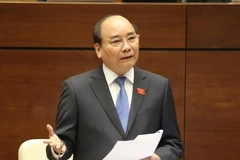 Thủ tướng Chính phủ Nguyễn Xuân Phúc trả lời chất vấn các đại biểu quốc hội. (Ảnh: Phương Hoa/TTXVN)
