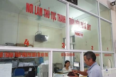 Người bệnh làm thủ tục thanh toán chi phí khám chữa bệnh bảo hiểm y tế. (Ảnh: Thuỳ Giang/Vietnam+)