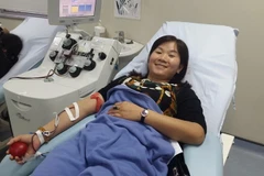 Chị Lê Thanh Nam đã có 64 lần tham gia hiến máu. (Ảnh: PV/Vietnam+)