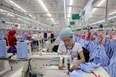 Công ty TNHH May Tinh Lợi, tại Khu công nghiệp Lai Vu, huyện Kim Thành, Hải Dương. (Ảnh: Trần Việt/TTXVN)