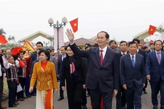 Chủ tịch nước Trần Đại Quang dự Ngày hội "Sắc xuân trên mọi miền Tổ quốc," sáng 24/2/2018, tại Làng Văn hóa-Du lịch các Dân tộc Việt Nam ở Đồng Mô, Sơn Tây, Hà Nội. (Ảnh: Doãn Tấn/TTXVN)