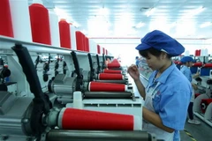 Dây chuyền sản xuất sợi tại Công ty TNHH Dệt nhuộm Jasan Việt Nam vốn đầu tư của Trung Quốc tại khu công nghiệp Phố nối B, huyện Mỹ Hào, tỉnh Hưng Yên. (Ảnh: Phạm Kiên/TTXVN)