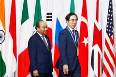 Lễ đón Thủ tướng Nguyễn Xuân Phúc dự Hội nghị cấp cao Nhóm các nền kinh tế phát triển và mới nổi hàng đầu thế giới (G20). (Ảnh: Thống Nhất/TTXVN)