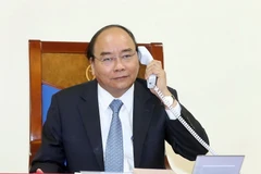 Thủ tướng Nguyễn Xuân Phúc điện đàm với Thủ tướng Vương quốc Đan Mạch Lars Lokke Rasmussen. (Ảnh: Thống Nhất/TTXVN)
