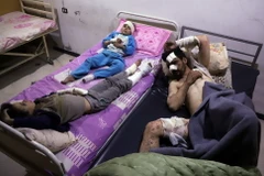 Người dân bị thương do giao tranh ở Đông Ghouta ngày 7/3. (Nguồn: AFP/TTXVN)