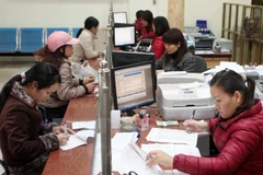 Giao dịch tại Agribank. (Nguồn: TTXVN)