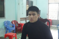 Đối tượng Lê Huỳnh Đức bị bắt giữ. (Ảnh: Văn Việt/TTXVN)