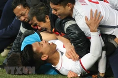 Niềm vui của các cầu thủ U23 Việt Nam sau khi thắng U23 Qatar sau những loạt đá 11m. (Ảnh: Hoàng Linh/TTXVN) 