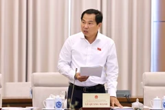 Chủ nhiệm Ủy ban Tài chính, Ngân sách của Quốc hội Lê Quang Mạnh trình bày tóm tắt báo cáo. (Ảnh: Doãn Tấn/TTXVN)