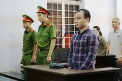 Bị cáo Trần Đình Trung tại phiên tòa. (Ảnh: Thanh Tân/TTXVN)