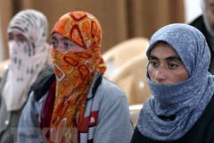 Các con tin người Yazidi được IS trả tự do. (Nguồn: AFP/TTXVN)