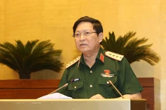 Đại tướng Ngô Xuân Lịch, Bộ trưởng Bộ Quốc phòng giải trình ý kiến của đại biểu Quốc hội. (Ảnh: Doãn Tấn/TTXVN)