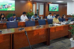 Phóng viên, biên tập viên tác nghiệp tại một trung tâm báo chí. (Ảnh minh họa. Thu Hoài/TTXVN)