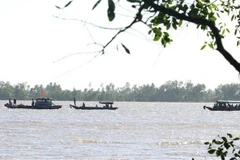 Tìm kiếm người mất tích. (Ảnh minh họa. Nam Thái/TTXVN)