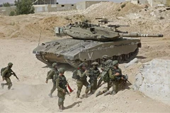 Binh sỹ Israel tham gia cuộc diễn tập quân sự với tình huống chiến tranh tại Dải Gaza tại căn cứ quân sự Tzeelim ngày 3/7/2018. (Ảnh: AFP/TTXVN)