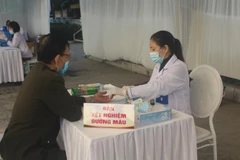 Khu vực lấy máu xét nghiệm đường huyết. (Ảnh: Khiếu Tư/TTXVN)