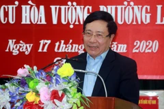 Phó Thủ tướng, Bộ trưởng Bộ Ngoại giao Phạm Bình Minh nói chuyện với nhân dân ở khu dân cư Hòa Vượng, phường Lộc Vượng, thành phố Nam Định, tỉnh Nam Định. (Ảnh: Văn Đạt/TTXVN)